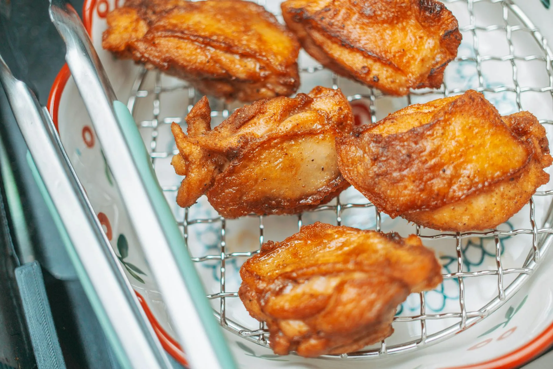 Crispy food cooking inside an air fryer basket