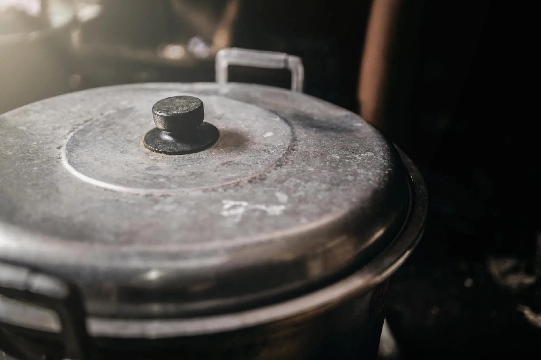 Large pot of stew being cooked on a hob for batch meal prep