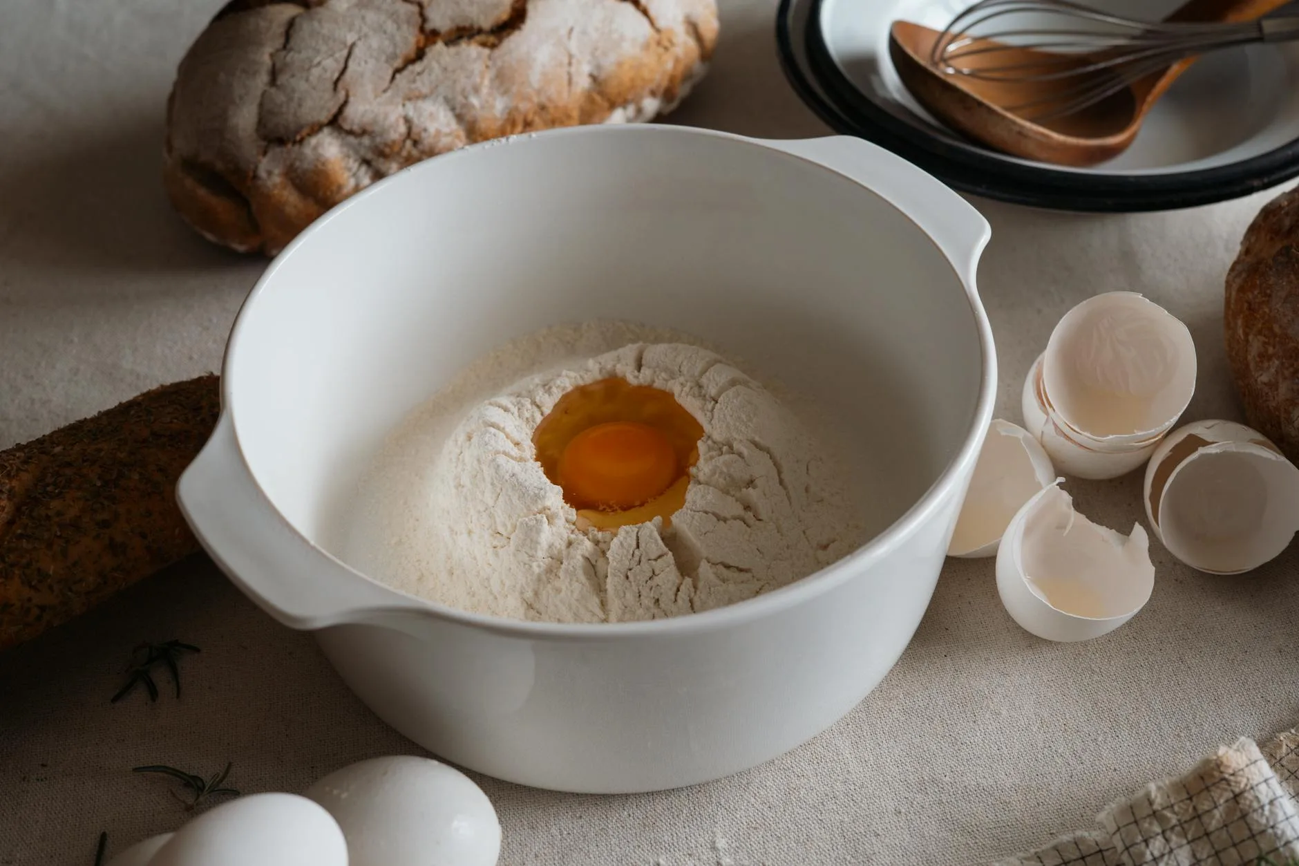 Bread baking ingredients with flour on a kitchen counter