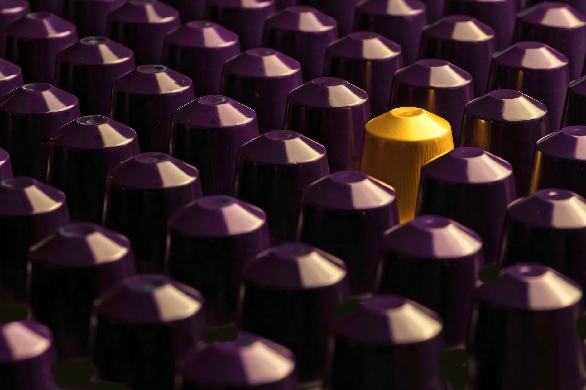 Variety of coffee capsule pods showing different brands and colours