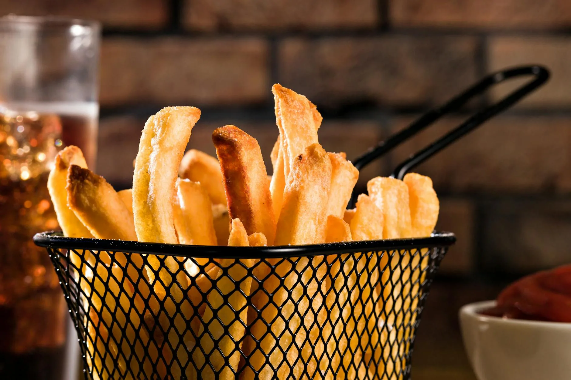 Crispy golden chips in an air fryer basket
