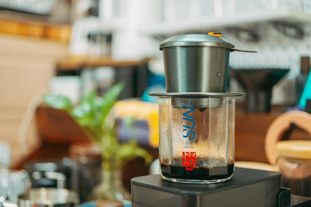 Filter coffee machine brewing on a kitchen worktop