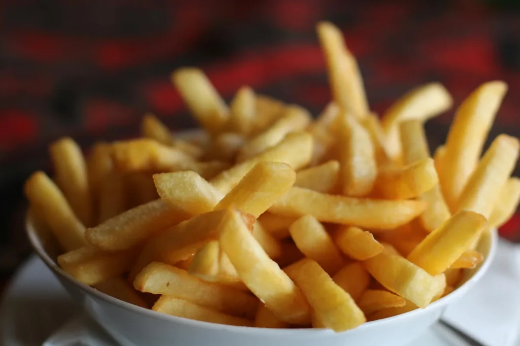 Golden crispy chips on a plate cooked with minimal oil