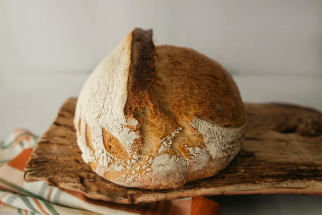 Freshly baked homemade bread loaf on a board