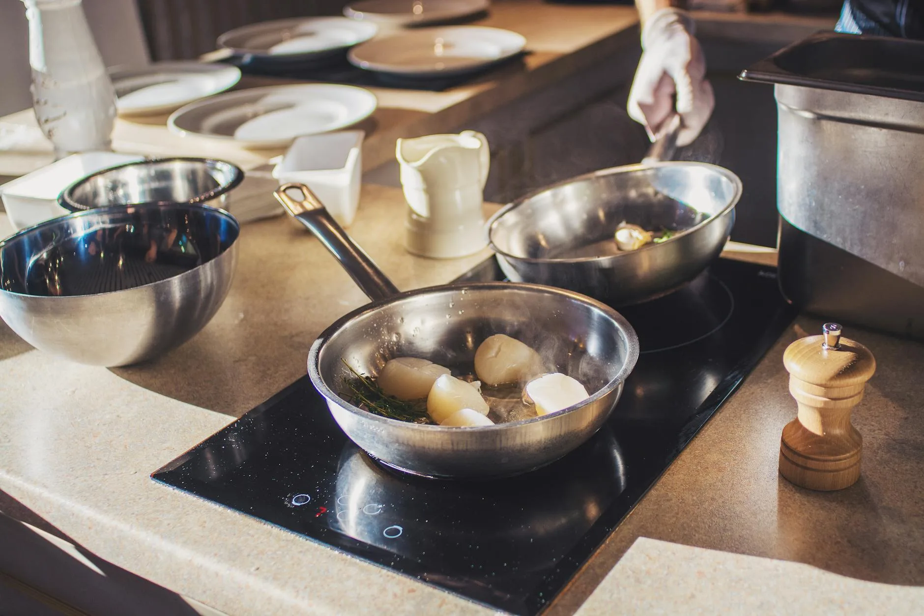 Induction hob with pan cooking in a modern kitchen
