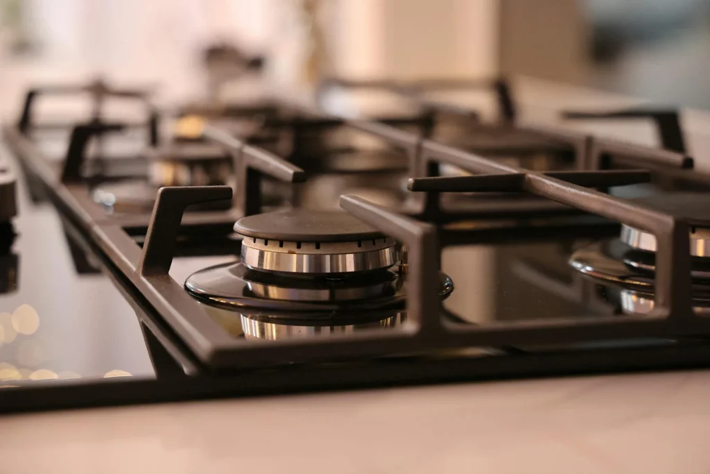 Modern kitchen hob with pans cooking on the surface