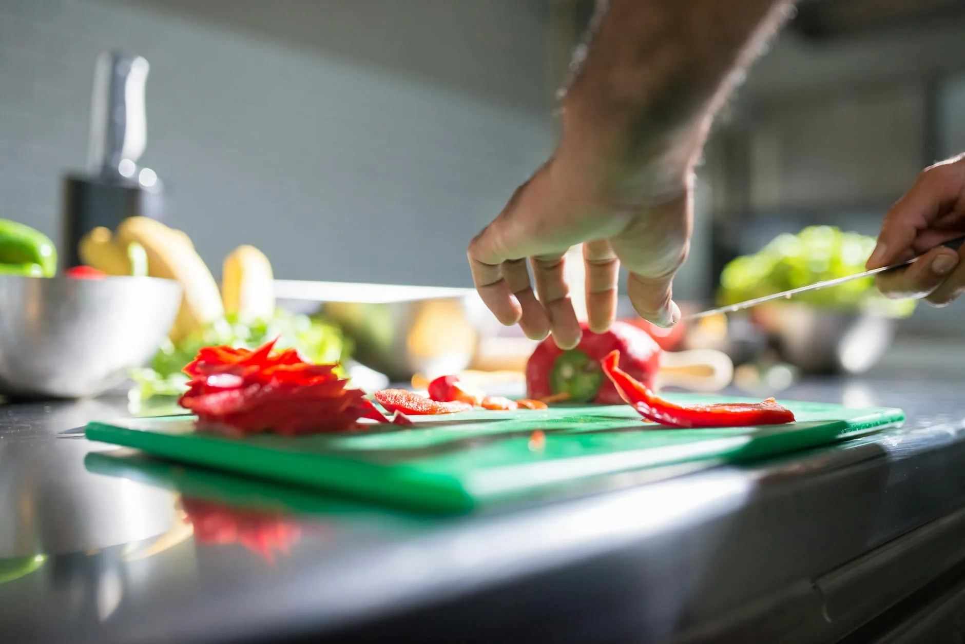 Vegetables being prepared on a cutting board for air frying
