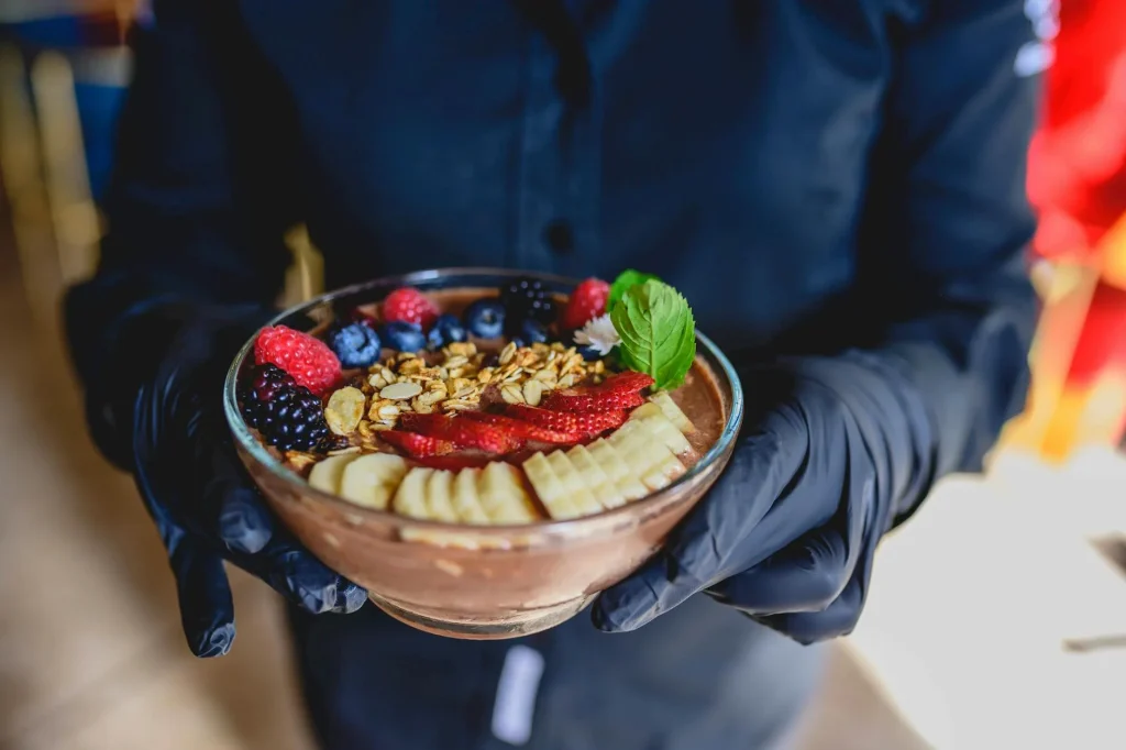 Smoothie bowl with berries and granola toppings