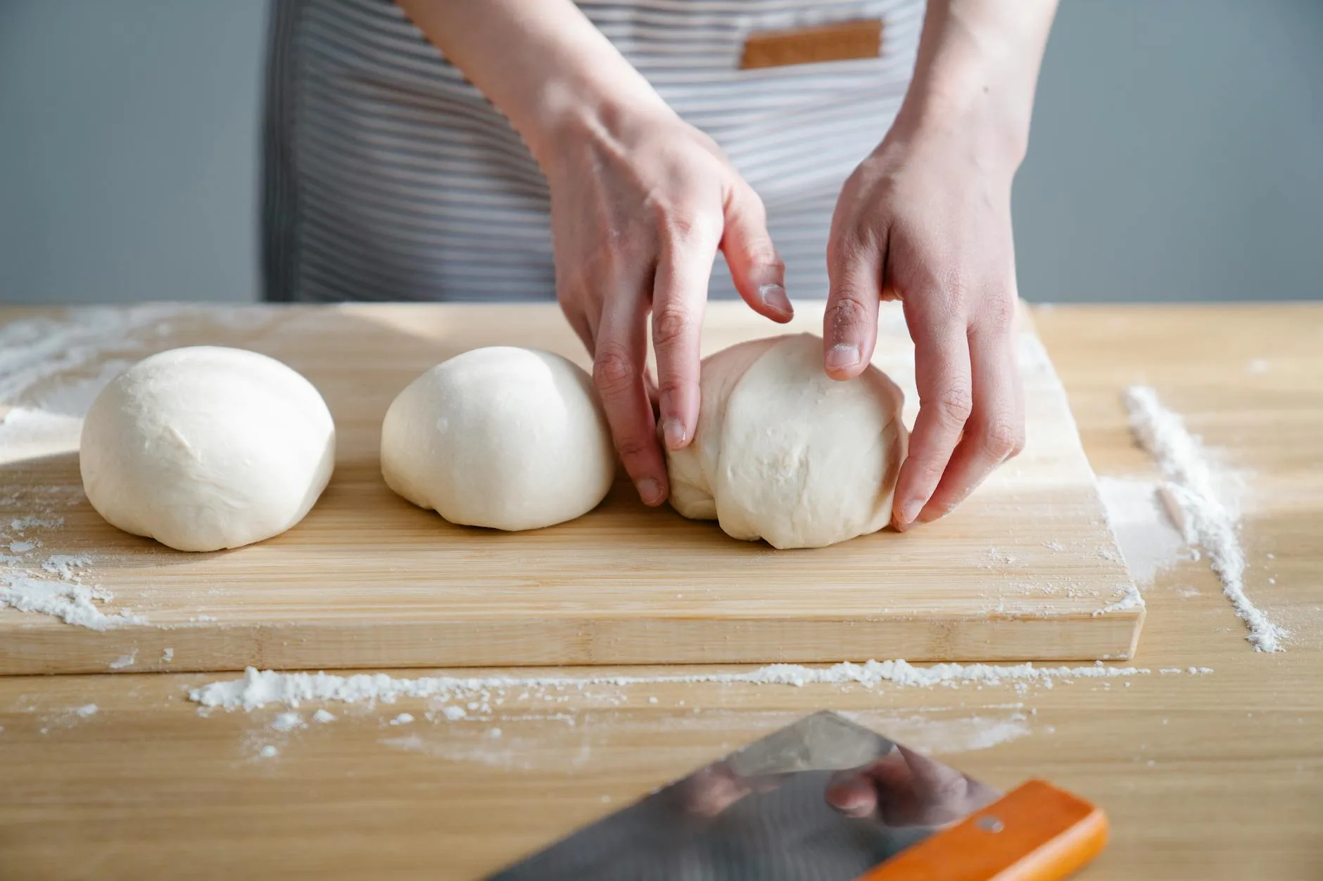 Stand mixer with dough hook kneading bread dough