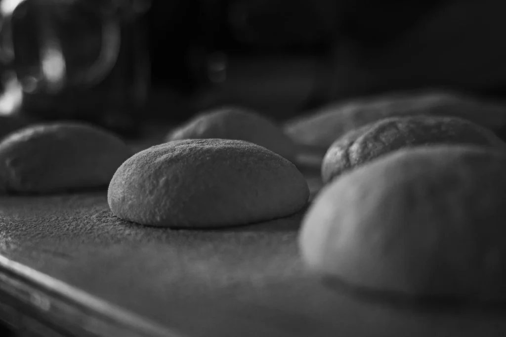 Stand mixer in a kitchen being used for baking dough