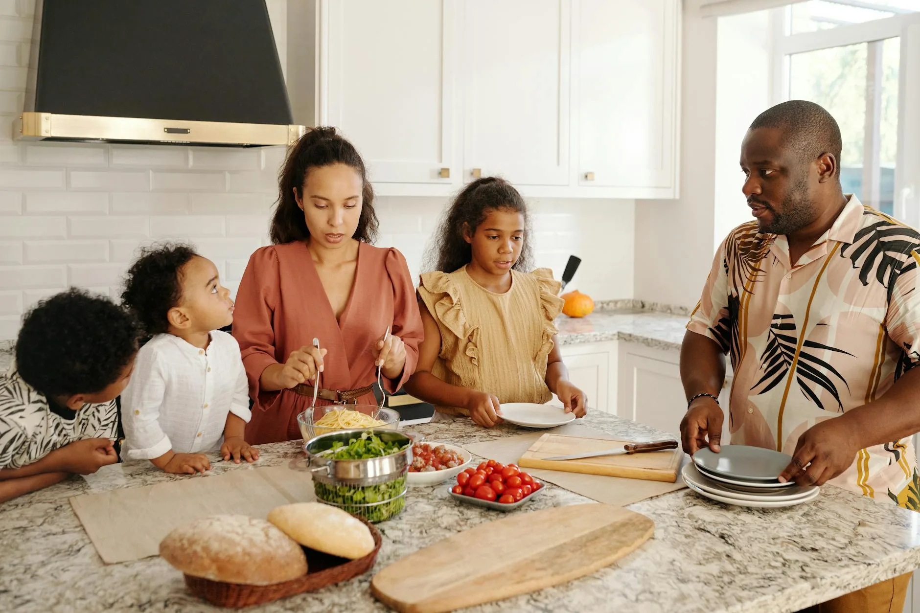 Family cooking together in a modern kitchen
