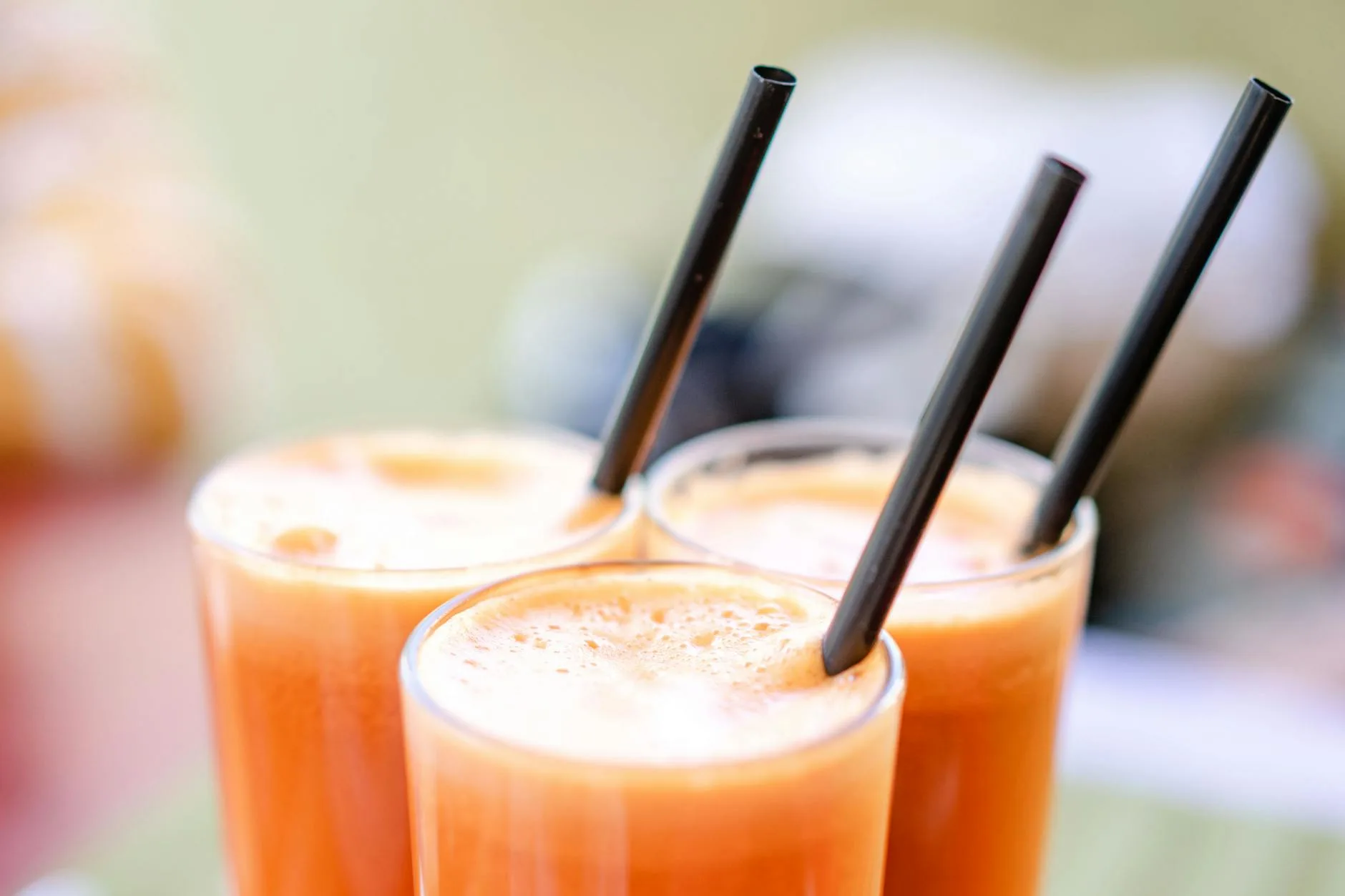 Fresh orange and carrot juice in a glass for a healthy morning drink