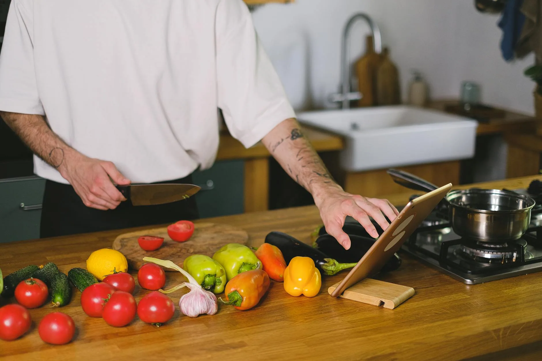 Person using a mandoline slicer to cut vegetables