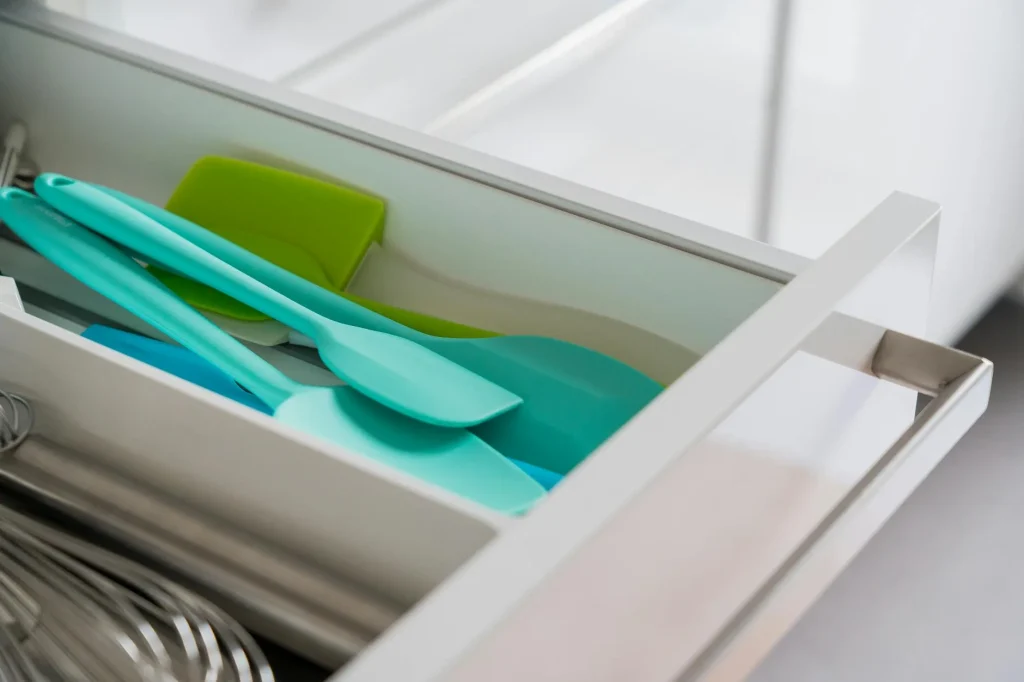 Kitchen gadgets and utensils neatly organized in a drawer