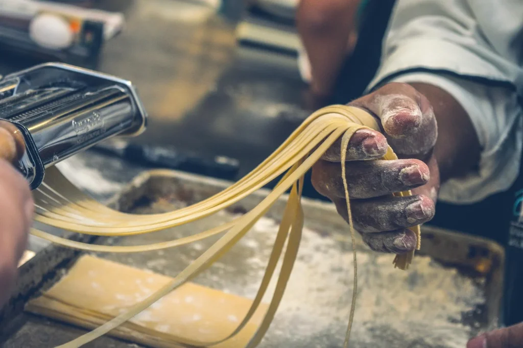 Fresh homemade tagliatelle pasta dusted with flour
