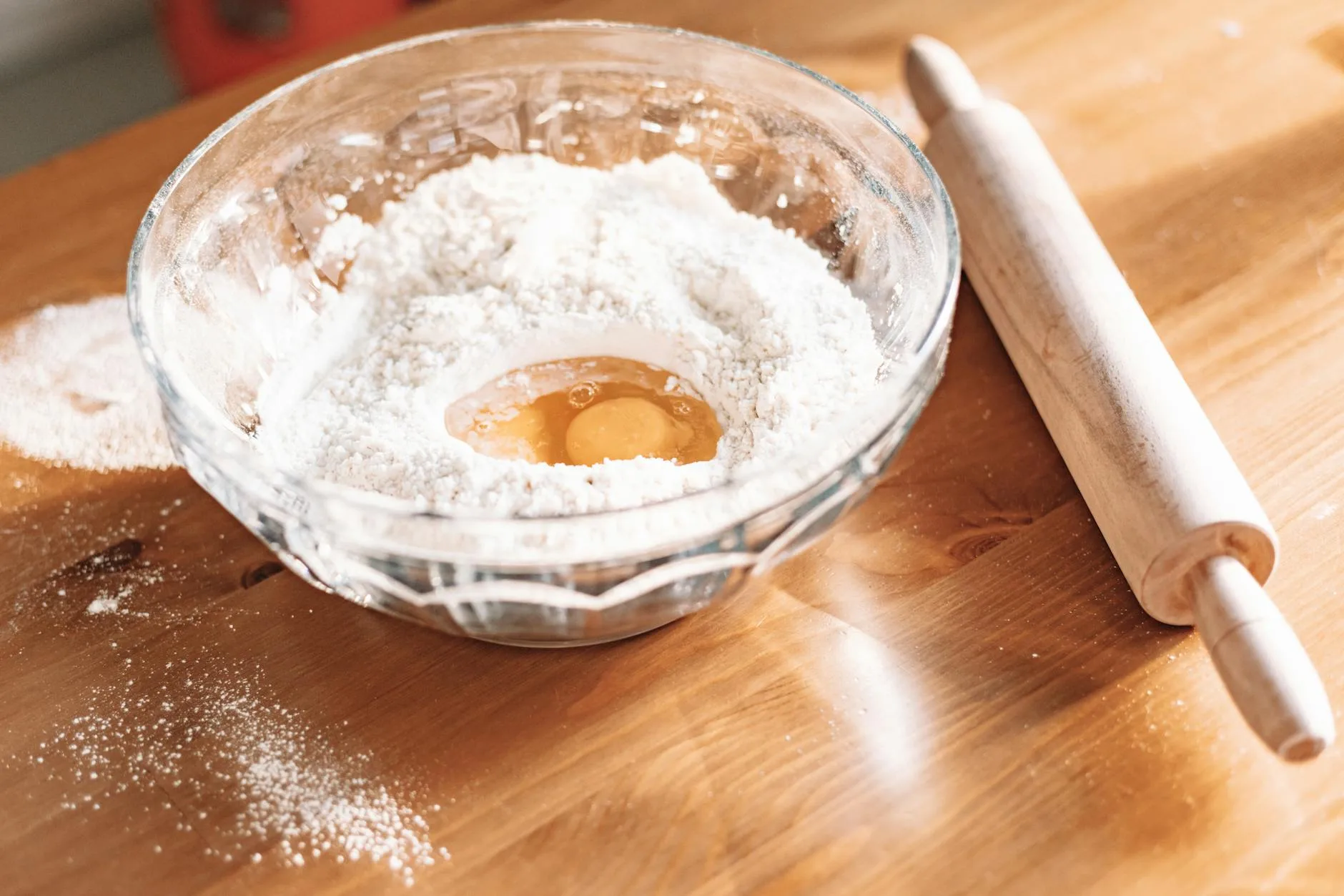 Eggs and flour on a work surface for fresh pasta dough