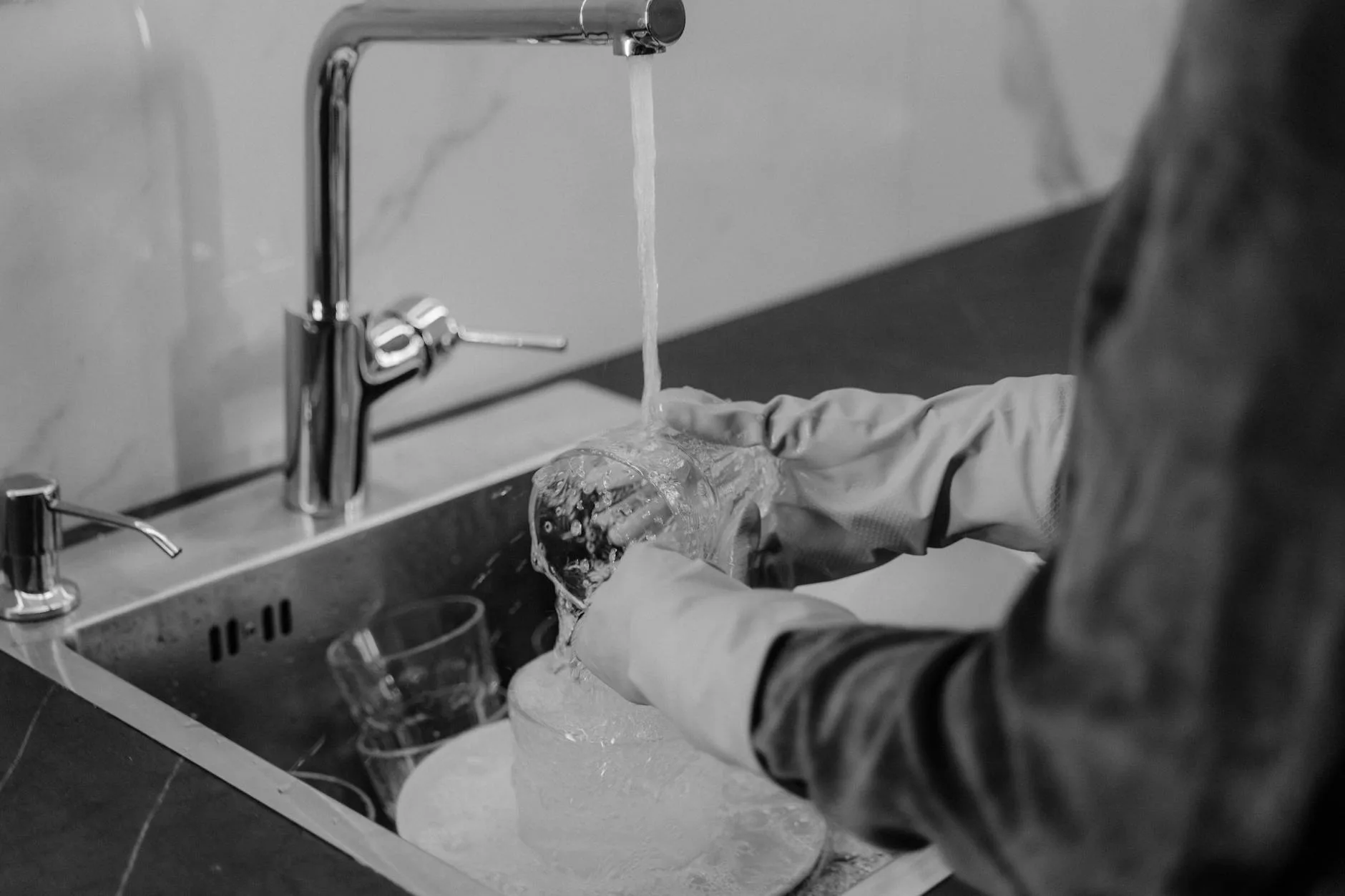 Cleaning a blender cup in a kitchen sink