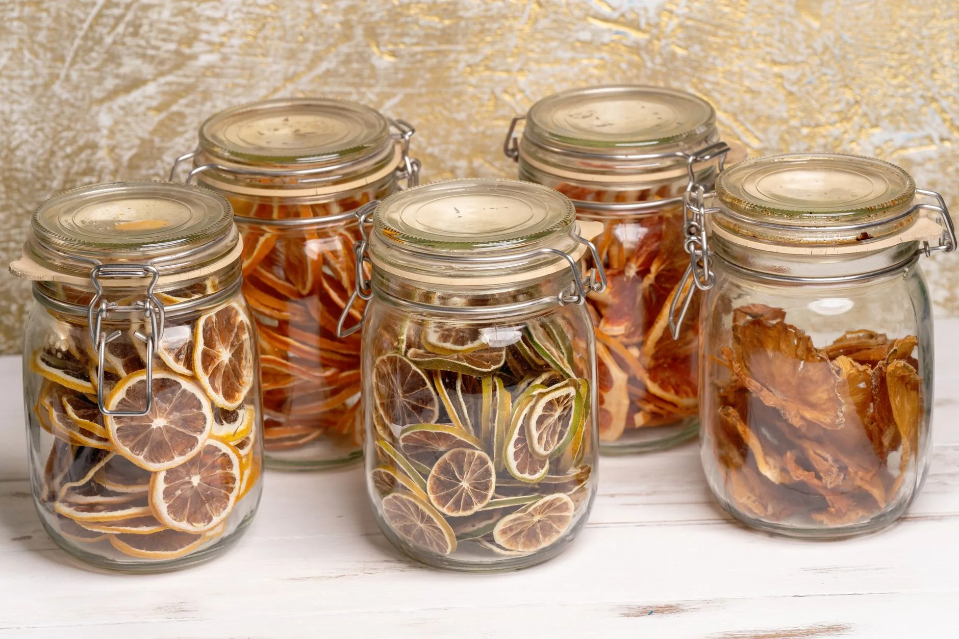 Fruit slices arranged for dehydrating in an air fryer basket