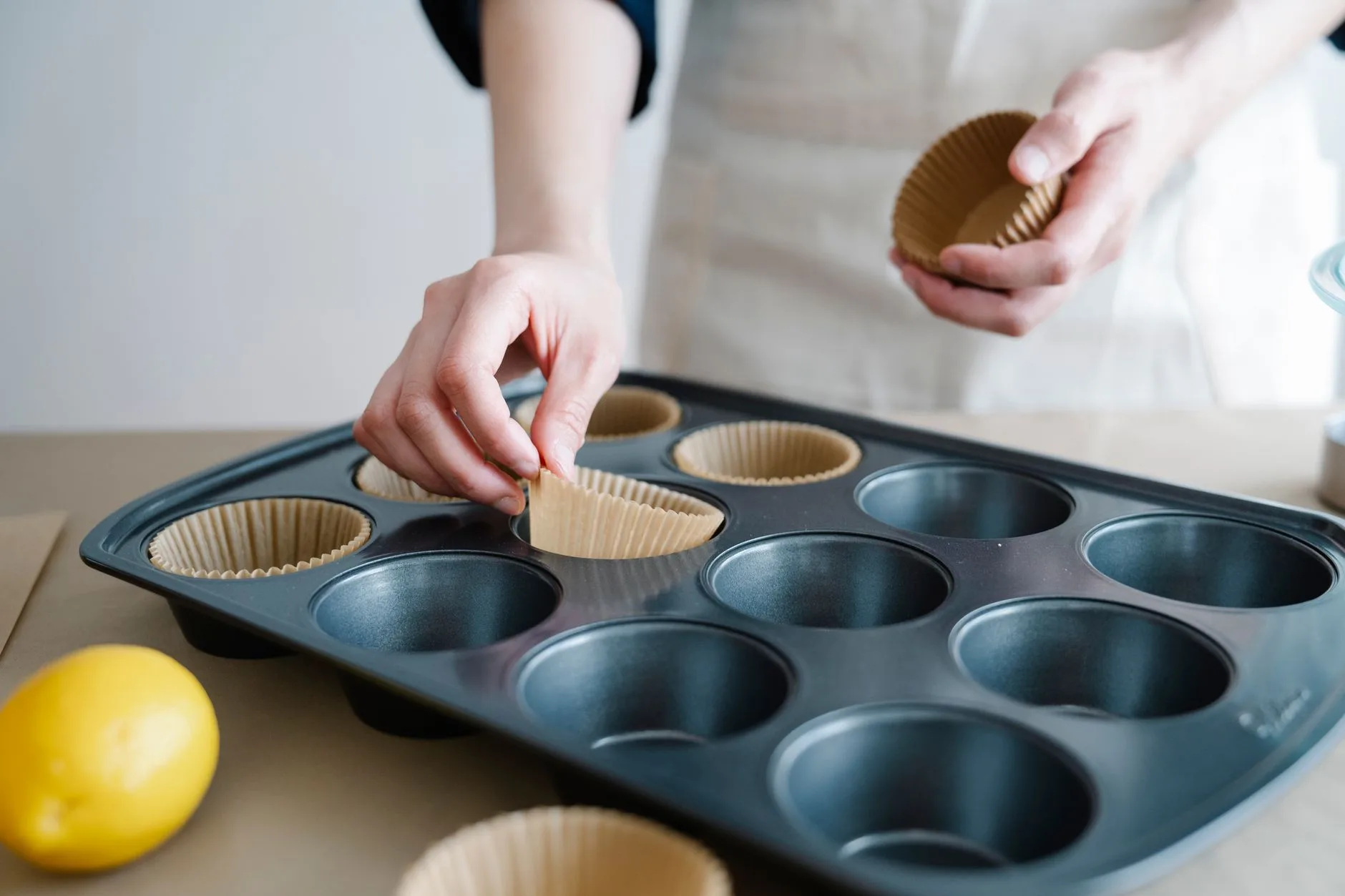 Muffin tin lined with paper cases for home baking