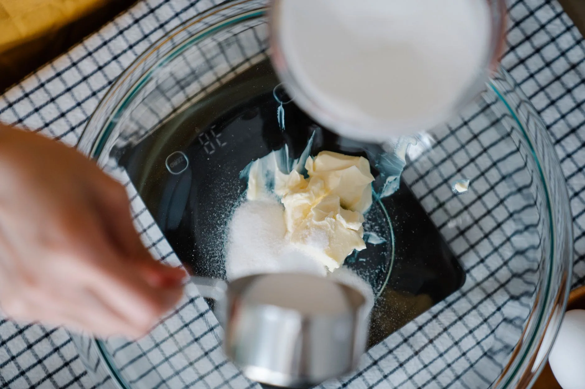 Kitchen scales measuring sugar in grams for baking accuracy