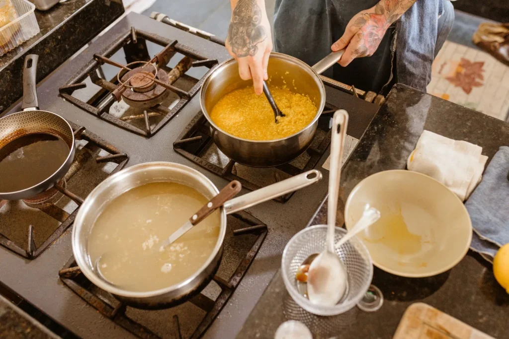 One-pot cooking in a deep saucepan on a kitchen hob
