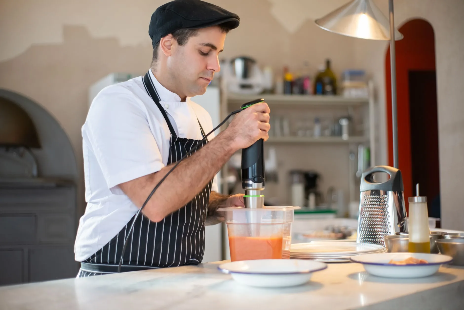 Vegetable soup being blended safely in a kitchen blender