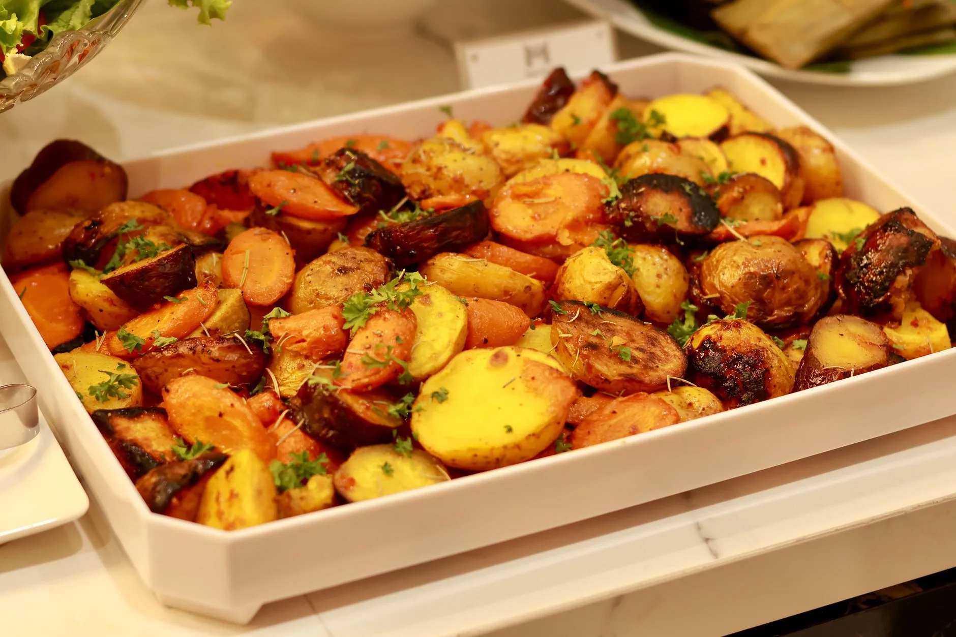 Sturdy oven tray with roasted vegetables in a kitchen